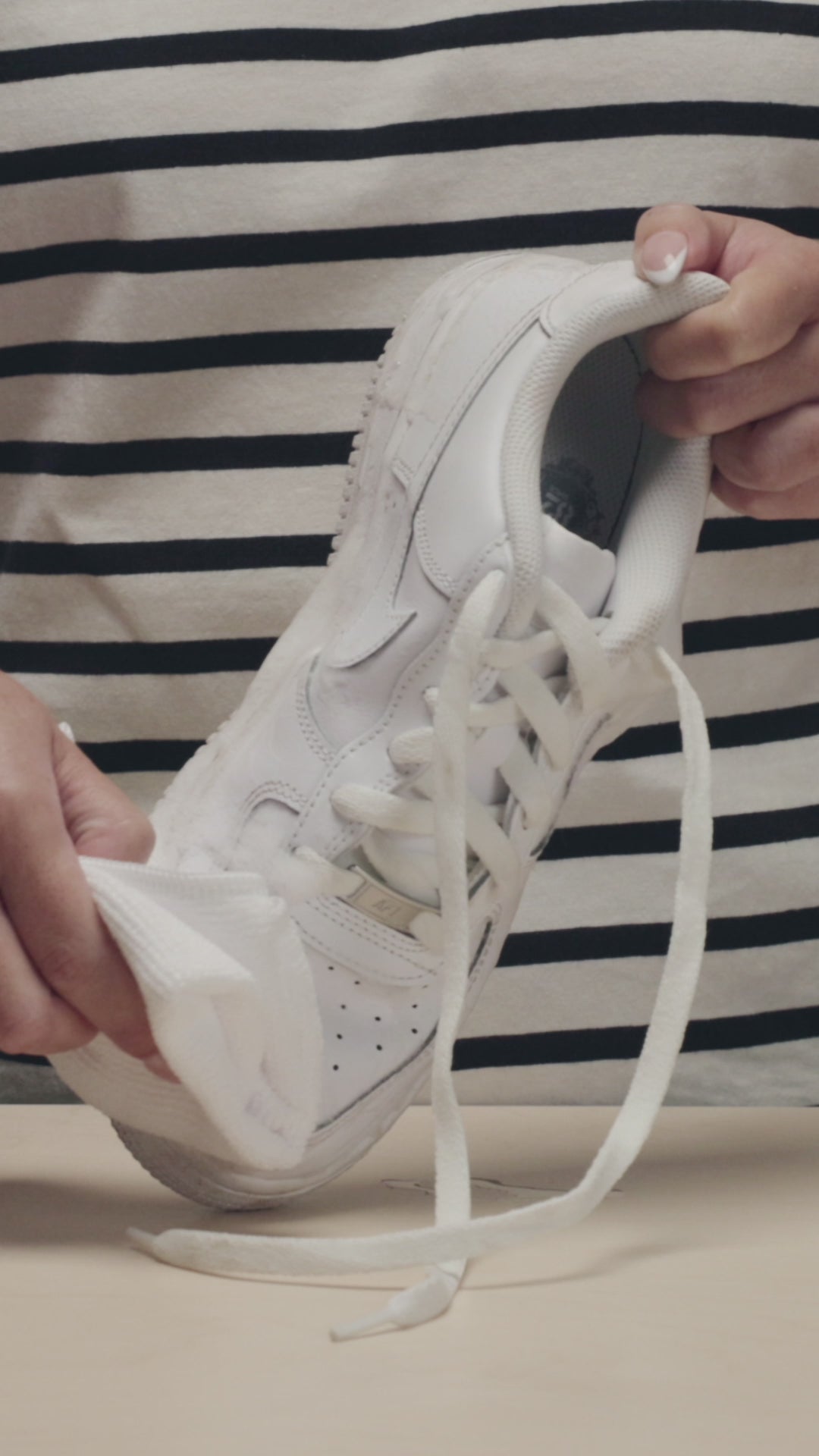 JASON MARKK MICROFIBER TOWEL WIPING A PAIR OF NIKE AIR FORCE 1 SHOES CLEAN