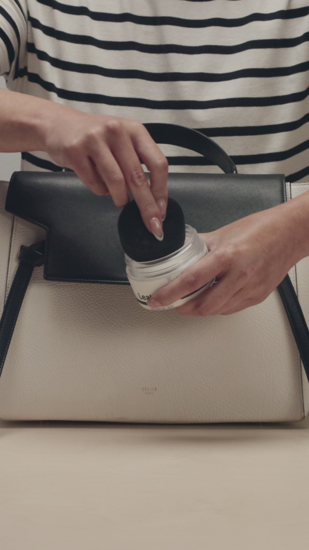 APPLYING THE JASON MARKK LEATHER BALM TO THE APPLICATOR THEN CELINE BAG TO MOISTURIZE AND CONDITION LEATHER