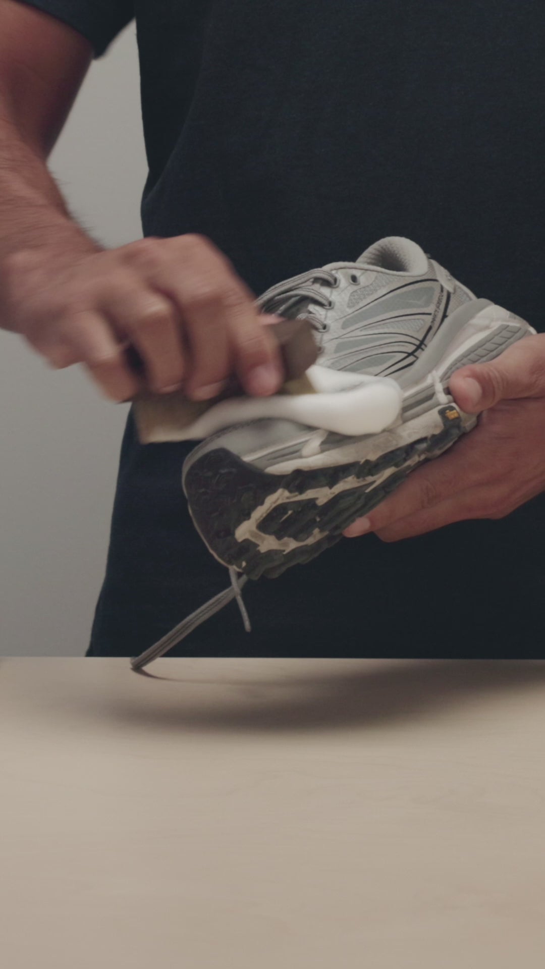 SCRUBBING A HOKA MAFATE SPEED 2 WITH A JASON MARKK DELICATES CLEANING BRUSH AND READY-TO-USE FOAM CLEANER